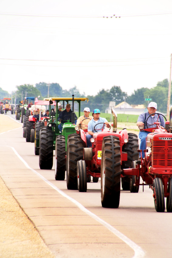 The WHO Tractor Ride arrives in Eldridge on East Leclaire Road about 11:20 a.m. Monday.