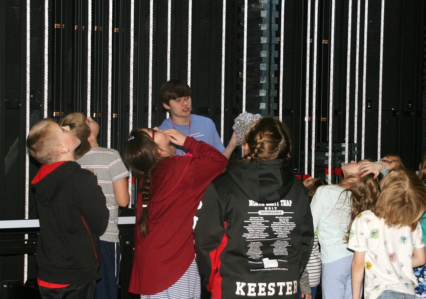Students get a look at the rigging while Owen Popelka leads a tour of the auditorium.