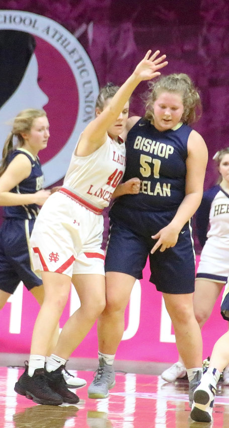 After Heelan's Ella Skinner scored 13 first-half points, Lancer junior Adriane Latham was tenacious on defense and held her to zero the rest of the way.