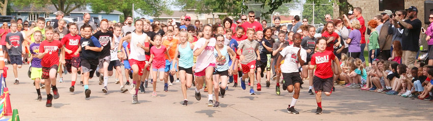 With their fellow classmates cheering them on, students from Neil Armstrong take to the streets of Park View for the annual Eagle Marathon.