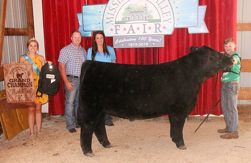 Dawson Book showed the Grand Champion Market Steer that was also the Champion Crossbred. He's pictured with Mississippi Valley Fair Queen Chloe Engelbrecht and judges Cori and Ryan Malone.