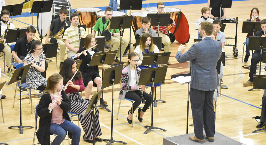 The Wilton junior high band hosted an in-person spring concert March 16 in the high school gym. Under the direction of band director Jakson Cole (pictured), the band performed &quot;Drive&quot; by Mark Williams, &quot;Meeting at Tryon Place&quot; by Richard Saucedo, &quot;Tyrannosaurus Charlie&quot; by Dean Sorenson, &quot;A Blues to Grow On&quot; by Dean Sorenson, and &quot;Arabian Dances&quot; by Roland Barrett. Members of the band are shown above during the live show. The next junior high band concert is May 10 at 7 p.m. in the high school gym.