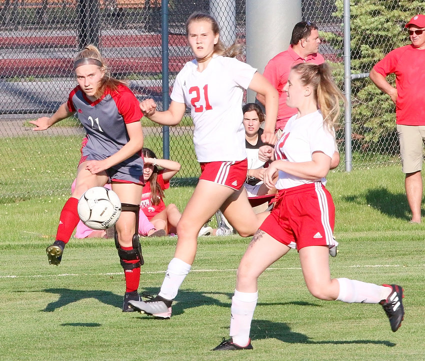 Freshman Bailie Arbogast fires a cross pass in the semifinal victory over Fort Madison.