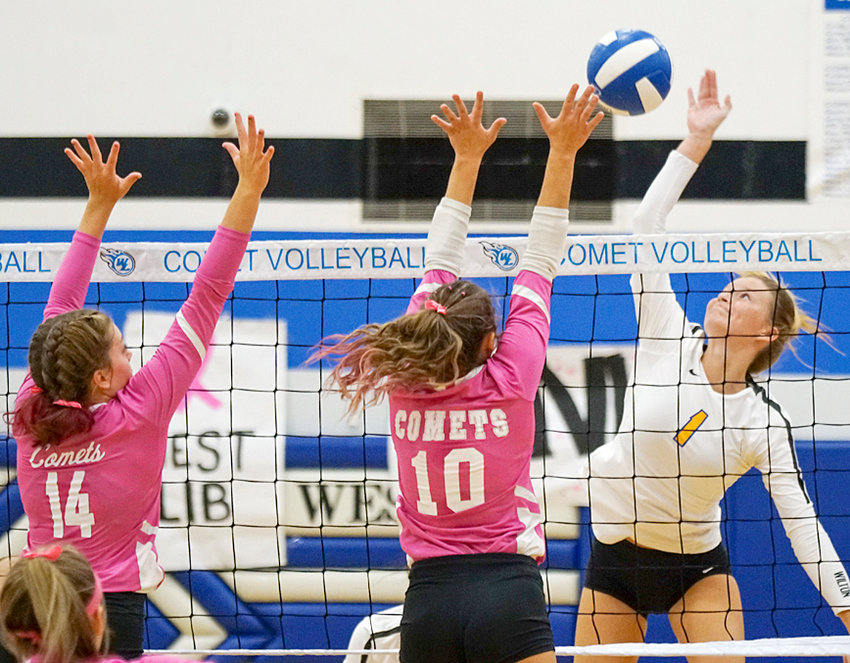 Wilton senior Kelsey Drake is shown attempting to hit over the West Liberty block in road RVC action Sept. 30. The Beavers beat the Comets in four games.