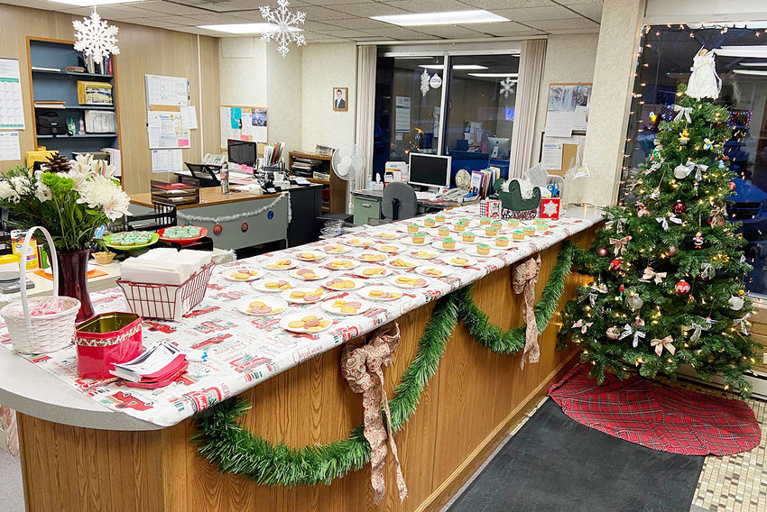 The Advocate News office is shown above, ready for visitors during Wilton's Window Walk Dec. 5. Treats were presented on plates this year, with health and safety of visitors in mind.