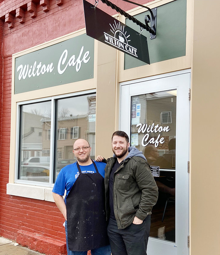 Brothers Mendim and Sakir &quot;Chili&quot; Alimoski are pictured in front of the Wilton Cafe on Christmas Eve, Chili's last official day of ownership. The brothers worked out a deal in 2021 for Mendim to purchase the family business, which was owned by their father Andy from 2003 to 2015, when Chili became sole owner. Mendim Alimoski is open for business in 2022 as the Cafe's new owner, and said, &quot;the majority of things will stay the same.&quot;