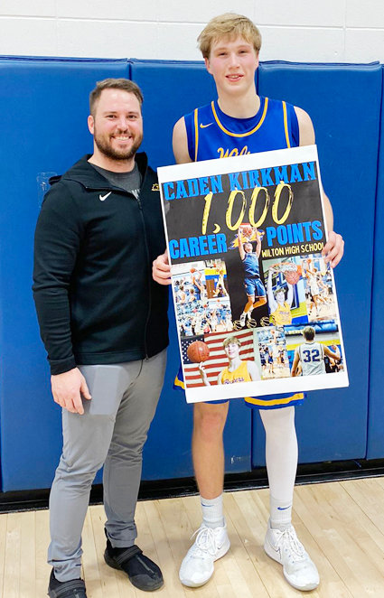 Beaver junior Caden Kirkman scored his 1000th career point in Friday's win over Bellevue. He's pictured with coach Erik Grunder.