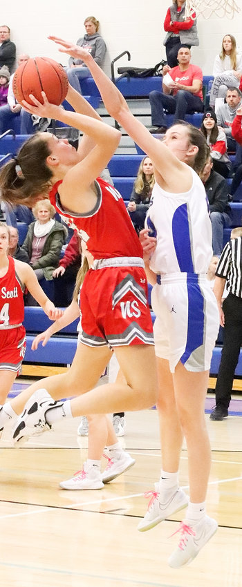 If ever a picture told the story, this is it, as Clear Creek Amana came up with 13 blocked shot, including 6'2&quot; Blis Beck's swat of this attempt by Lancer junior Lexi Ward.