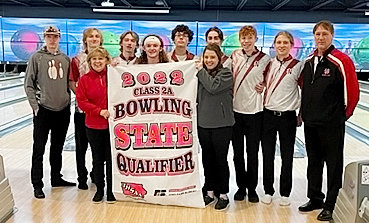 Although the format is different, North Scott's boys' bowling team was set to head into familiar territory at yesterday's (Tuesday) Class 2A state bowling tournament. The Lancers captured the district championship last week, and celebrating with the banner were (l-r): junior Mason Herrington, senior Jacob Ohsann, coach Marie Tharp, junior Lex Adkisson, senior Dylan Dufloth, junior Morgan Welch, assistant coach Katelyn Wolfram, junior Nik Davis (back), junior Michael Wilming, senior Weston Eichmeier and assistant coach Paul Beadle.