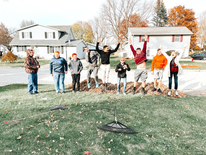 Nathanial Garland, Hunter Rummells, Casten Axtell, James Maske, Elijah Ramos-Ruiz, Austin Shafer, Steven Ocasio, Sam Gray, Meabh Moore rake leaves for a Wilton resident as part of a life skills activity. All students participate in The Coffee Shack.