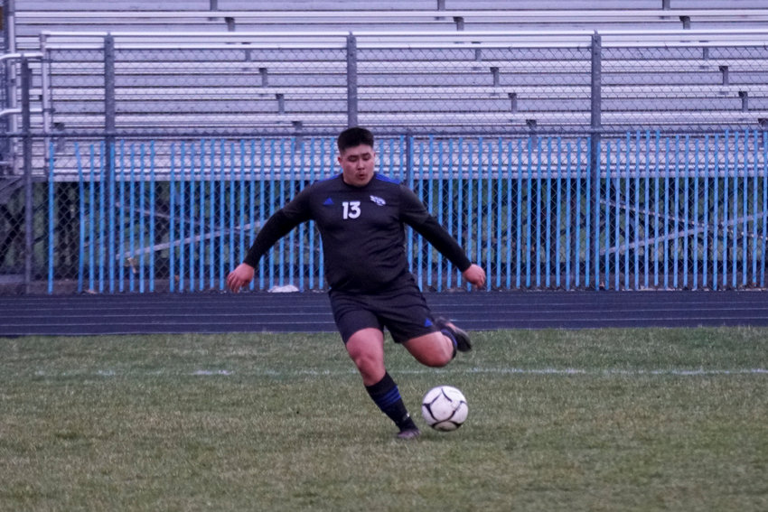 Adrian Frausto kicks the ball down field for the Comets.