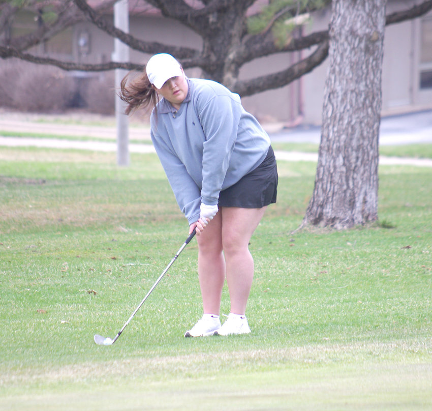 Kiley Stineman chips from the fringe at Duck Creek April 12.Wildcat Chronicles