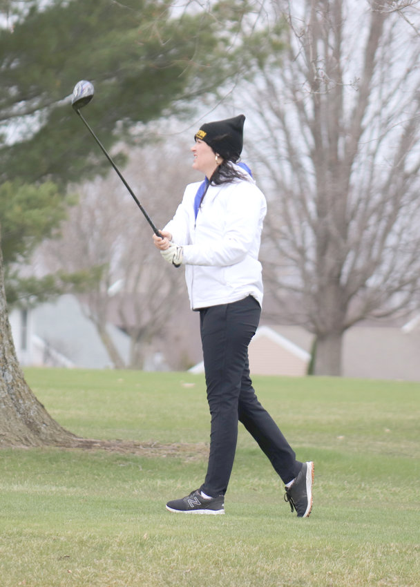 Wilton's Joann Martin tees off against the wind during a triangular with Mid-Prairie and West Branch April 18 at Wahkonsa.