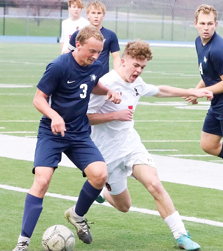 Lancer junior Ashton Kaiser gets physical with Pleasant Valley's Dylan Ollendieck.