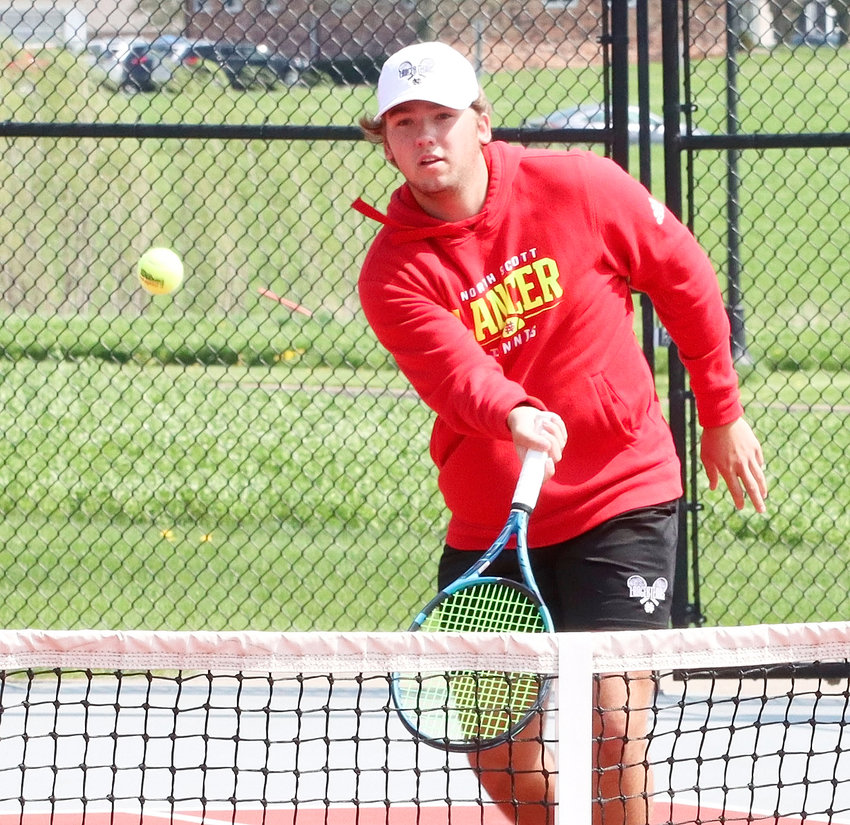 Senior Zach Johnson displayed a deft touch at the net in his quarterfinal singles  match, and then went on to finish third at Monday's district meet.