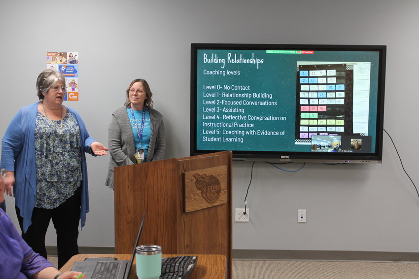 Teachers Melody Russell, on left, and Kim Wiele give the West Liberty School Board of Education an update on the district's Teacher Leadership and Compensation program that is now in its sixth year.