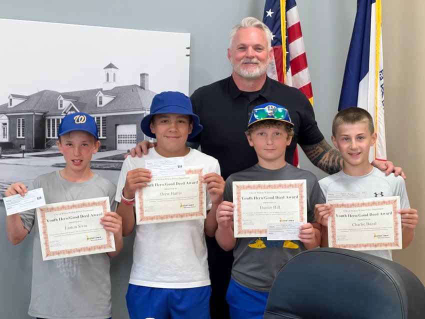 Four Wilton boys were honored with Young Hero Awards at the June 27 council meeting. The boys discovered an injured woman while riding their bikes, and stopped to help.