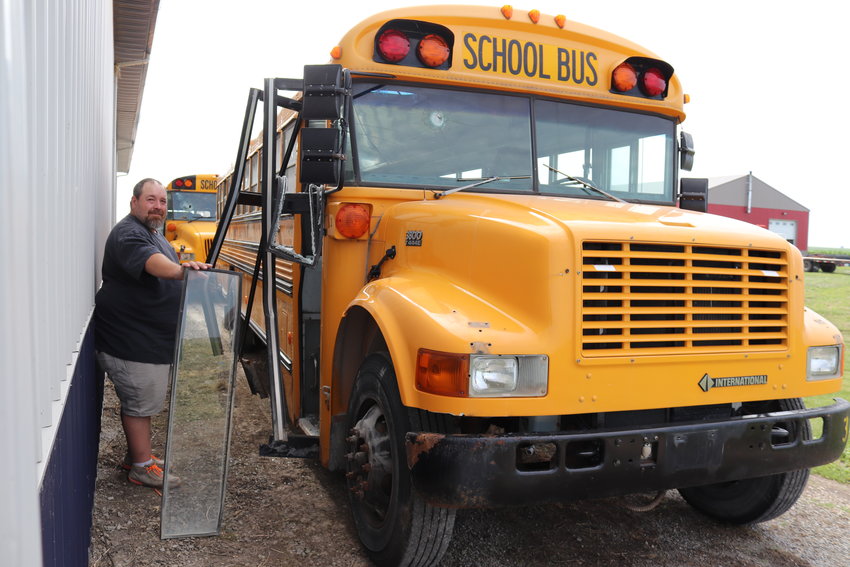 Richard Creamer, transportation director of both Wilton and Durant schools, holds up a broken window pane from a Durant school bus that was used in a MSORT training exercise June 29.