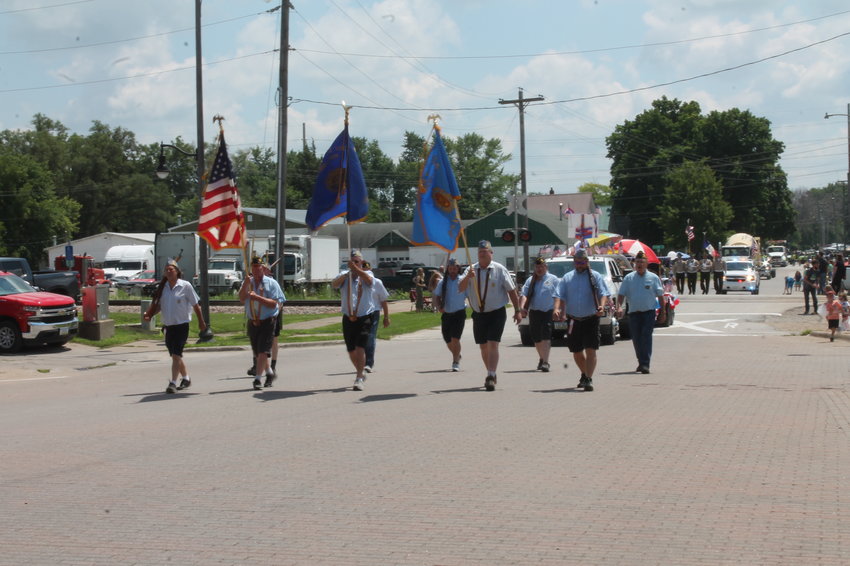 Members from the Mansell L. Phillips American Legion Post 509  and Sons of the American Legion members carry flags during the 2022 Fair Parade in West Liberty. Commander Ken Riley said they are struggling to keep members and discussed closing the local Legion Post