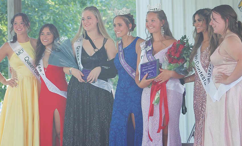 Pictured from left are Muscatine County County Fair 2022 Queen candidates Joann Martin, Paola Palma, first runner-up Anna Marine, 2021 Muscatine County Fair Queen Haylee Lehman, 2022 Fair Queen and Miss Congeniality Morgan Hodge, Jessica Ahluwalia and Rebekah Imhoff at the end of the queen contest, which was held Wednesday, July 20, at The Grove on the fairgrounds.