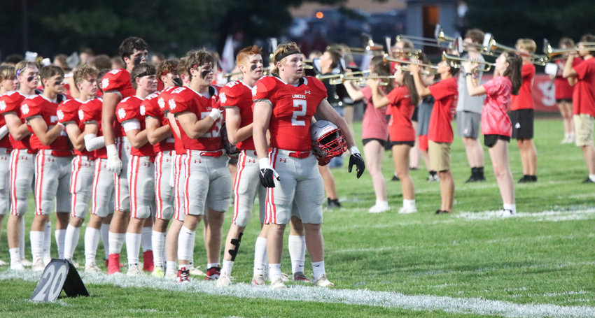 The Lancers band and football team kick off the home opener Friday with the national anthem.