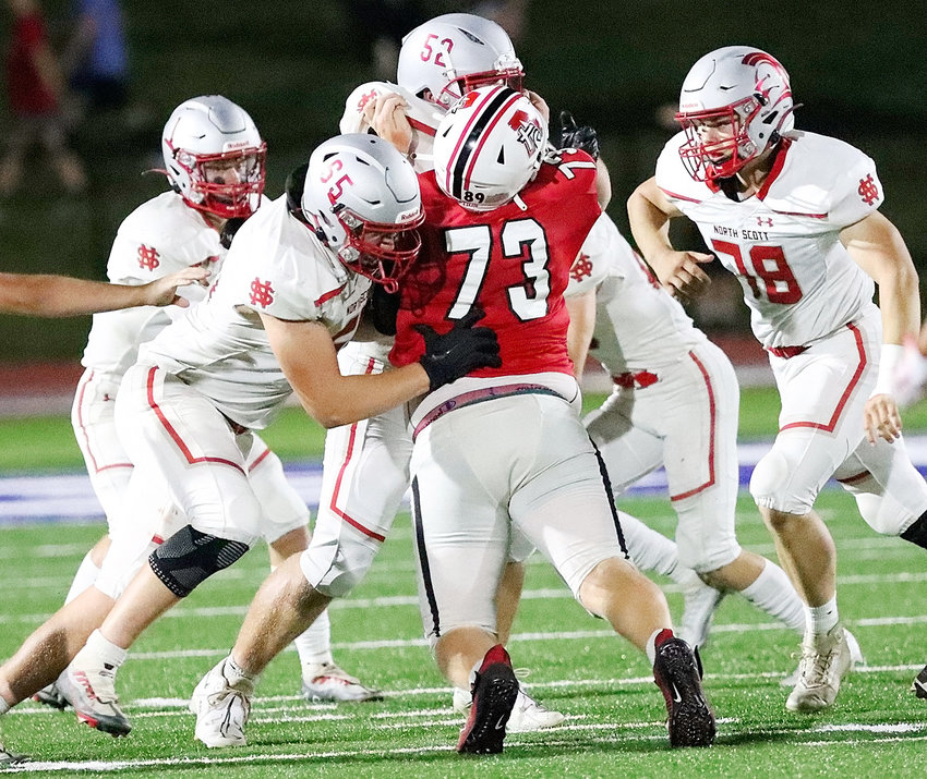 North Scott's offensive line did the dirty work in the trenchs, and Matt Cunningham (65), Zach McMillian (52) and Trever Gheer made things pretty rough on Assumption lineman Landen Derrer.