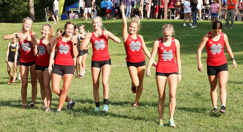 North Scott's varsity girls' team was loose and ready to roll as they headed to the starting line at last week's Lancer Invitational. From left: Kate Blodig, Kaitlyn Knoche, Ella Riniker, Bailey Boddicker, Anna Nichols, Carly Porter and Peyton Madison.