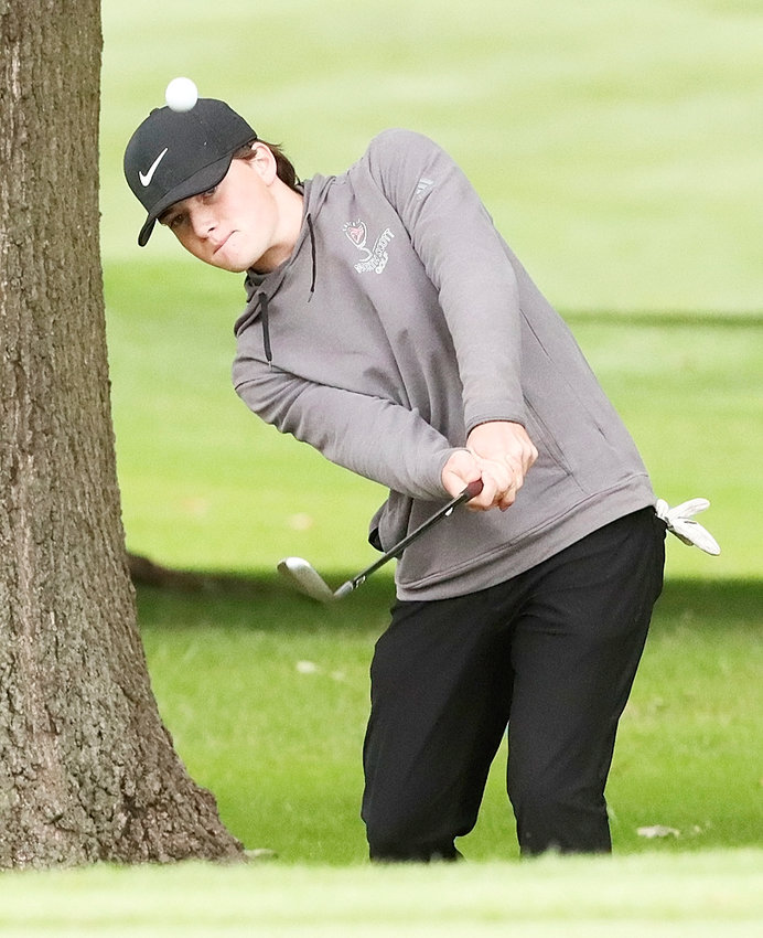 Senior Cal Behm was dialed in on this chip shot during Friday's opening round of the MAC tournament.