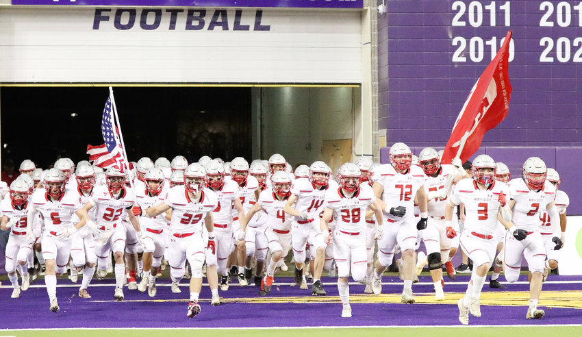 For the second time in three years, North Scott took to the field at the UNI-Dome for a Class 4A state semifinal contest. Lancers pictured include (l-r): Trevor Kilburg (5), Cole Jennings (22), Seth Madden (23), Ashton Kaiser (4), Aiden Barber (14), Dylan Marti (28), David Borchers (72), Nate Schneckloth (75), Drew Kilburg (3) and AJ Petersen (2).