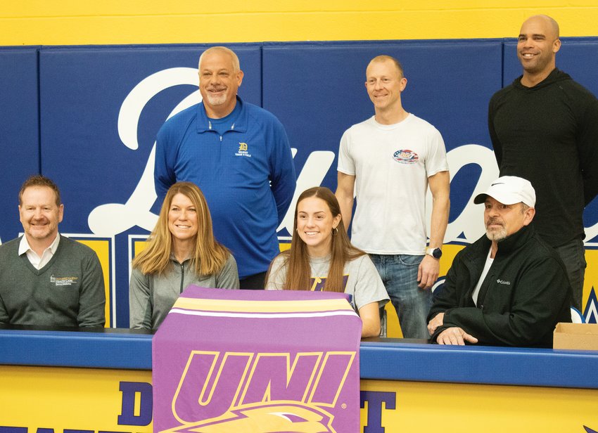 Durant track and field star Carlie Jo Fusco   surrounded by coaches and family at her   signing event on Tuesday, Jan. 24. From left,   front row Britt Marccussen, Tonya Looker, Carlie Jo Fusco,   Todd Fusco, back row Doug Frett, Andrew Hermiston, Jeremy Mims.jpg