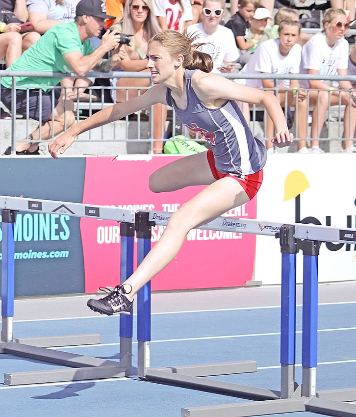 Lancer Sydney Skarich leaps over a hurdle during the state track meet last May at Drake University.