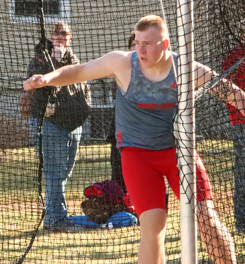 Lancer junior Zach McMillian watches after uncorking his 179-09 discus throw, which qualified him for the Drake Relays later this month.
