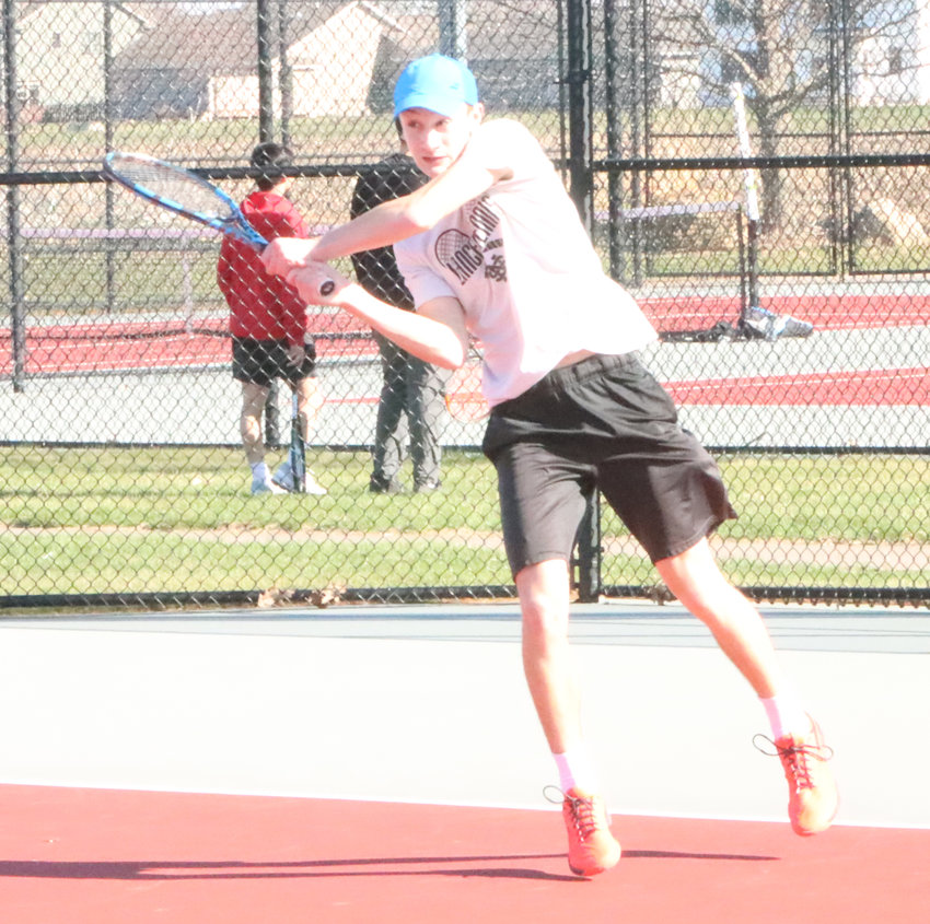 Freshman Lucas Persson drills a backhand during the first set against Pleasant Valley.