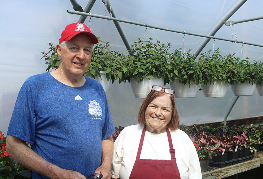 Dan and Linda Tuftee in one of their greenhouses.