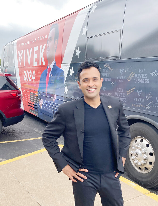 Vivek Ramaswamy poses with his tour bus.