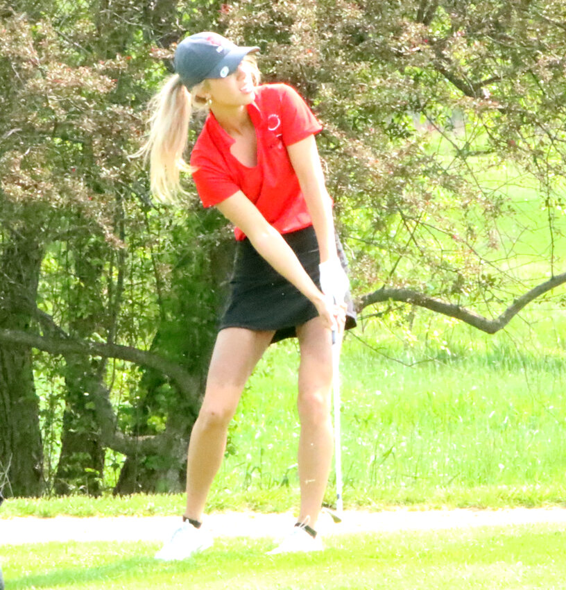 Senior Elle Loehr puts the finishing touches on her front nine 38 during the regional meet.