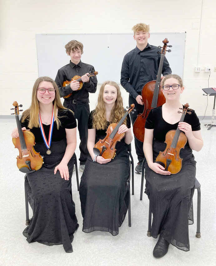 North Scott honor orchestra students, front row, from left, violinists Maddie Gustas, Alana Owen and Molly Hill.  Second row from left, violinist Ryan Squires and cellist Behren Radech.