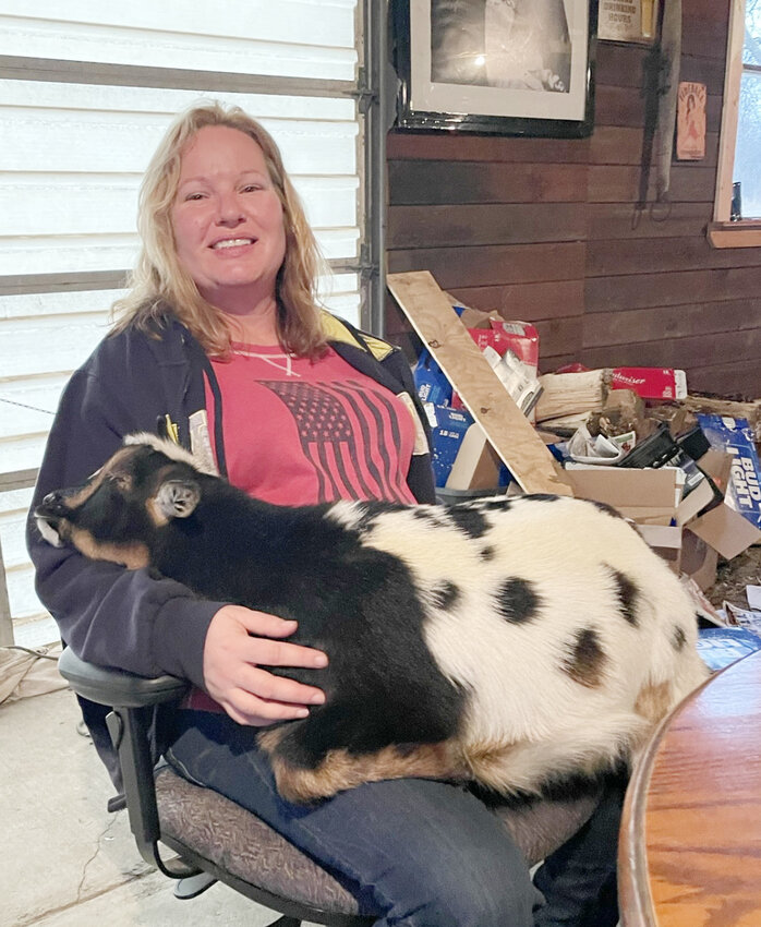 Shelley McNeil and a pet goat.