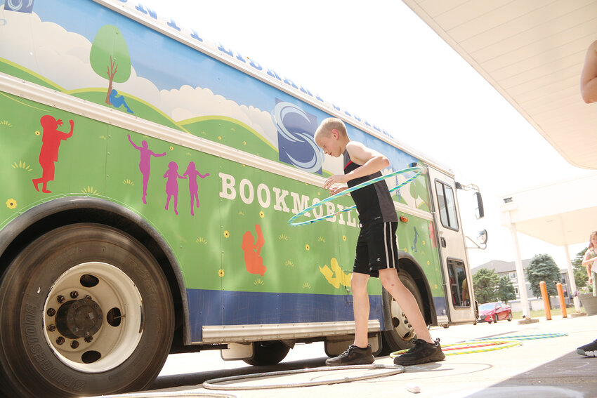 Beau Tooley, of Park View, joins the Scott County Library summer reading program kickoff, June 2, at the Eldridge branch.