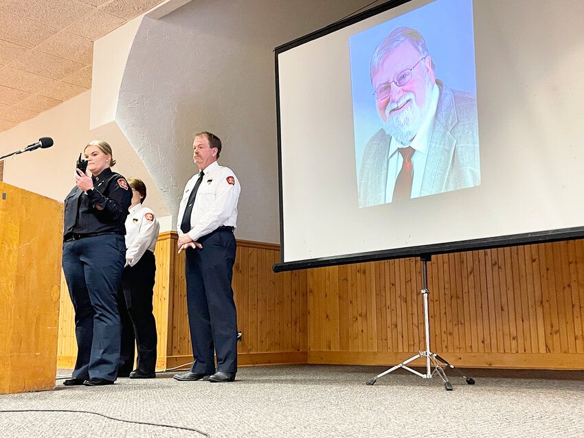 Walcott firefighters make a ceremonial last call May 6 for Phil Roberts, a volunteer and longtime Scott County journalist, including for The North Scott Press.