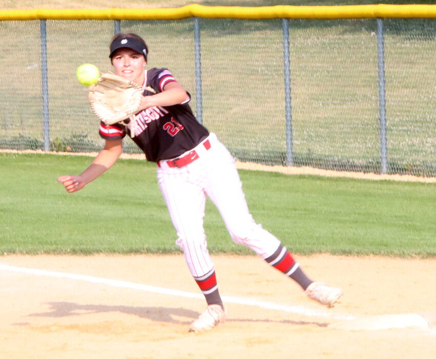 Senior Rylie Robertson covers first base after a bunt attempt in the first game of the doubleheader against North.
