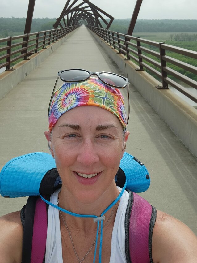 Karen Smith takes a selfie on the High Trestle Bridge in Madrid while on her journey walking across Iowa.