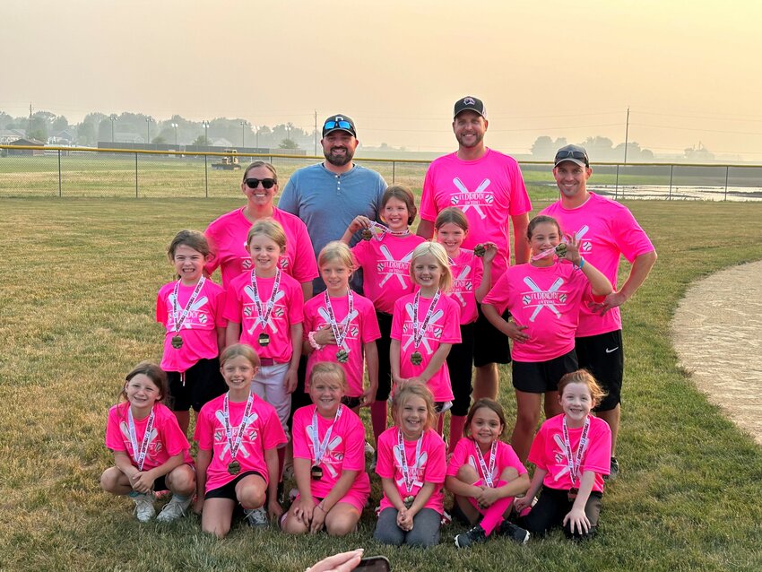 Bottom row, from left: Quinn, Sadie, Ava, Brenna, Maisie and Savanna.    Middle row, from left: Britta, Emmrie, Blakely, Charlee and Lennon.    Back row, from left: Layna and Cara (not pictured: Ansley)    Coaches, from left: Coach Bristley, Coach Burns, Coach Bolin and Coach Patterson.