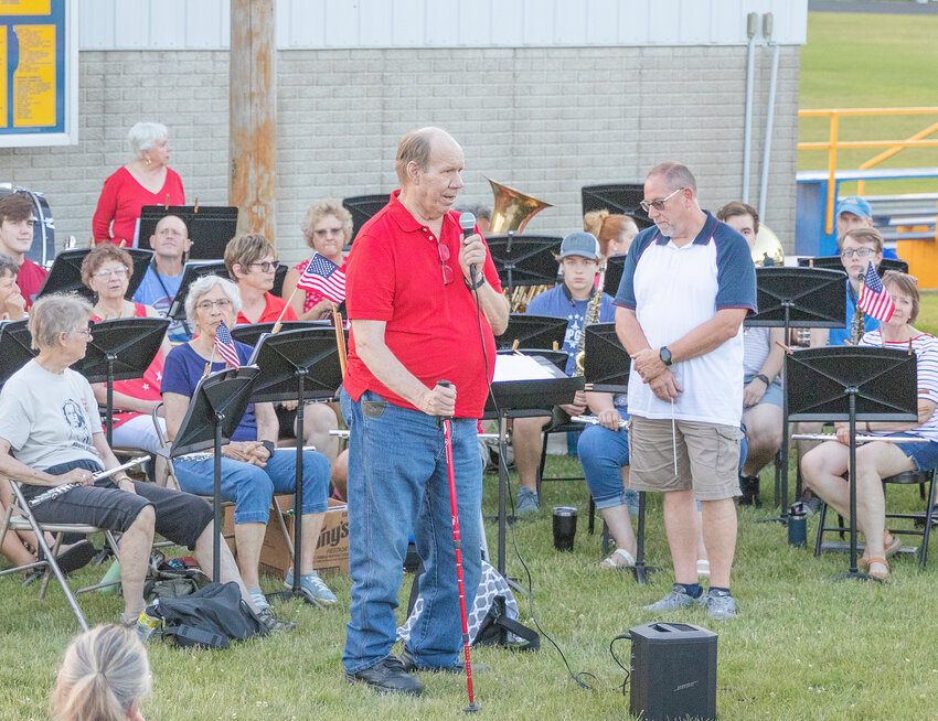 Roy Gehrls speaks before the TriCounty Community Band performs on Tuesday, July 4 at the Durant  High School Football Field