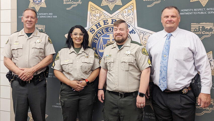 Scott County Sheriff Tim Lane, with new jail sergeants. Alyssa Cousins and Andrew Stark.