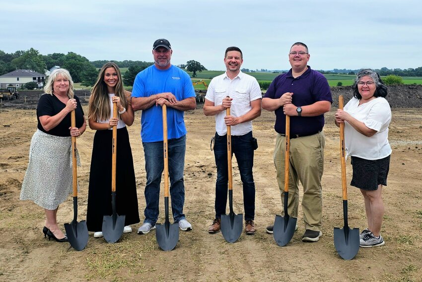 Pictured from left are West Liberty City Manager Lee Geertz, Greyson Conlon, Jason Dumont, West Liberty Mayor Ethan Anderson,   WeLead Executive Director Ken Brooks and West Liberty City Councilmember Cara McFerren at the groundbreaking of the Buysse  subdivision Wednesday, Aug. 2.
