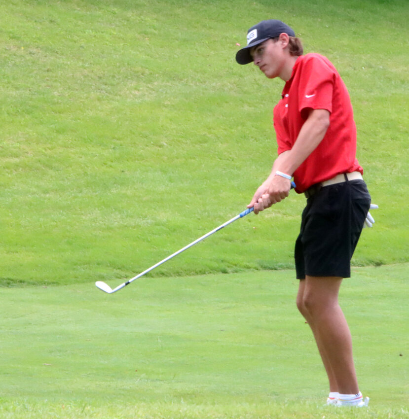 Junior Jack Gomez chips onto the green during North Scott's first tournament round of 2023.