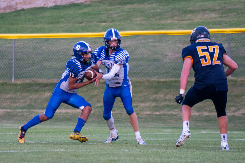 Diego Sanchez (No. 10) takes the ball from quarterback Ryker Dengler during last Friday's game.
