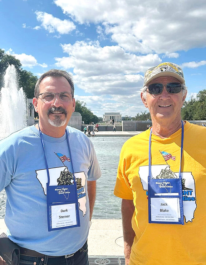 Durk Sterner and Jack Blake pause at the World War II memorial during a busy Honor Flight day.
