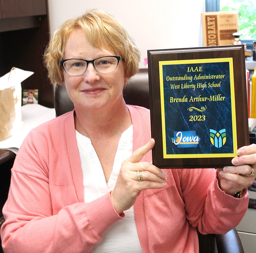 West Liberty High School Principal Brenda Arthur-Miller shows the Iowa Ag Education honor she was awarded in July.